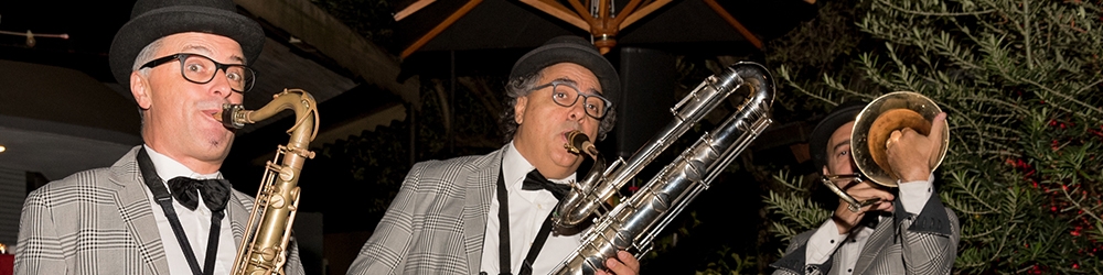 photo of brass band members playing at an event